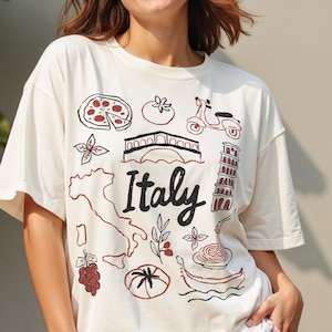 Camiseta italiana de verano con colores cómodos y estéticos, ideal para viajes por Italia, con un bonito gráfico para amantes de Italia y un ambiente de vacaciones costeras.