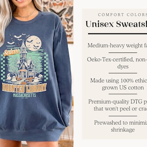 A card with details about the sweatshirts: The sweatshirt is pre-washed, uses oeko-tex-certified dyes, has a premium-quality DTG print, is made using ethically grown US cotton.