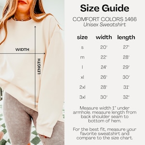 May include: A cream-coloured crewneck sweatshirt shown with a size guide chart for Comfort Colors 1466. The chart lists sizes S through 3XL with corresponding width and length measurements in inches, alongside instructions for measuring the garment.