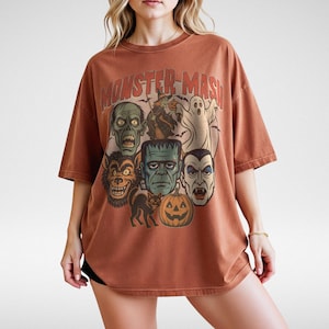 Yam Comfort Colors Monster Mash Halloween shirt with Frankenstein, Dracula, ghost, witch, and pumpkin retro horror design on a cinnamon-colored oversized tee.
