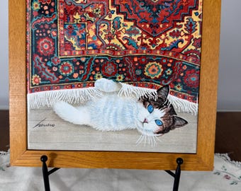 Decorative wall tile with a cat on a Persian rug by Lowell Herrero 1982 9.5 inches