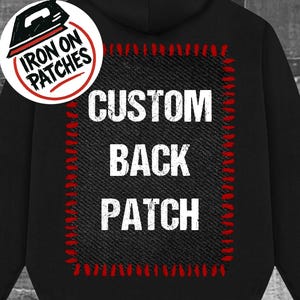 May include: Black hoodie with a large back patch that reads "CUSTOM BACK PATCH" in white block letters. The patch is outlined in red stitching. A circular "IRON ON PATCHES" logo is on the front.