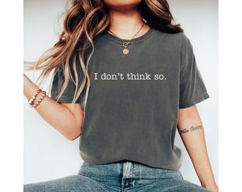 May include: A dark grey t-shirt with the text "I don't think so." printed in white on the front.