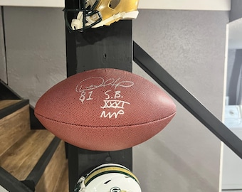 2 pack floating football display mount for laces against wall.