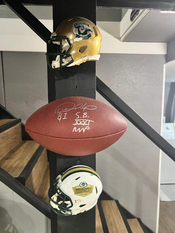 2 pack floating football display mount for laces against wall.