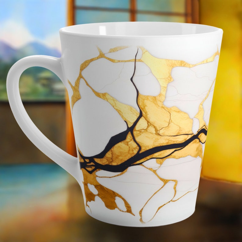 May include: White ceramic mug with a gold and black marbled design. The mug has a tall, tapered shape and a large handle.