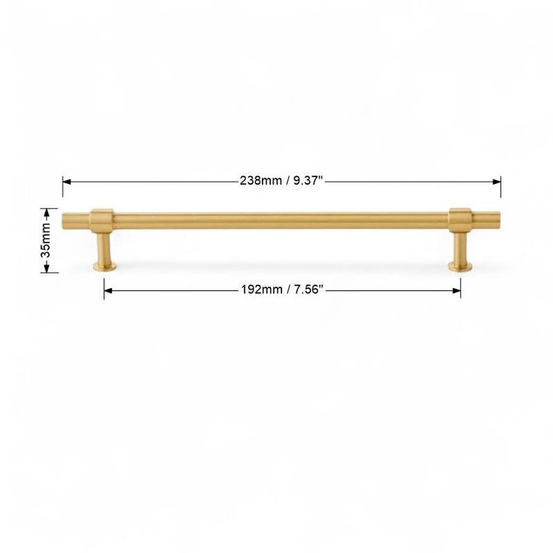 Brushed gold cabinet pull handle with 288mm hole spacing dimensions.