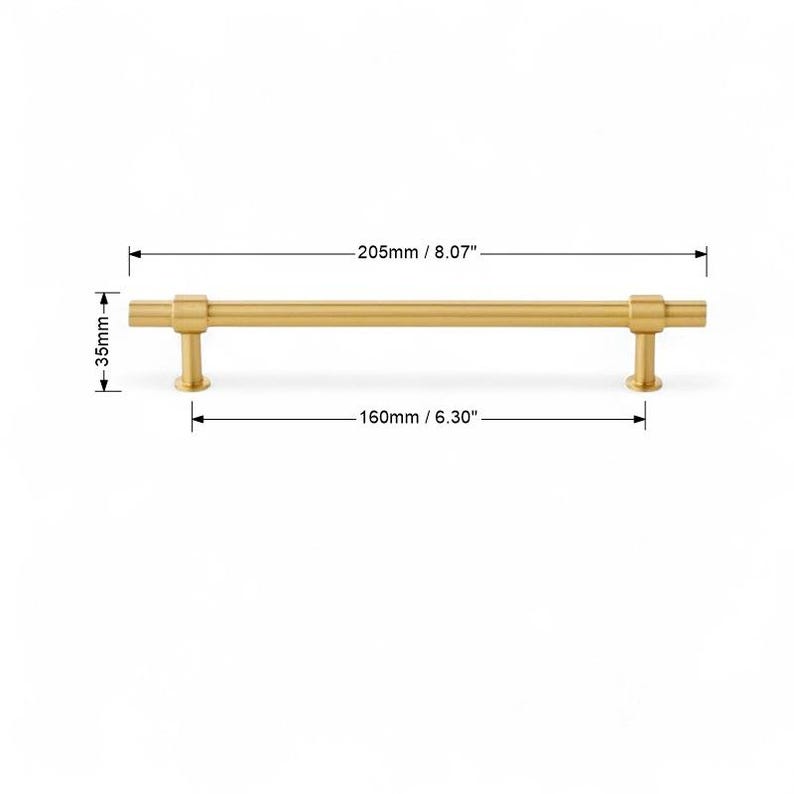Brushed gold cabinet pull handle with 192mm hole spacing dimensions.