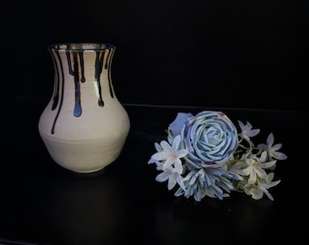 Hand-thrown ceramic vase with blue drip glaze