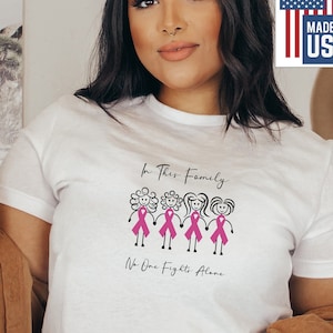 In This Family No One Fights Alone Cancer Shirt | Breast Cancer Donation| Breast Cancer Plus Size| Cancer Support T-Shirt