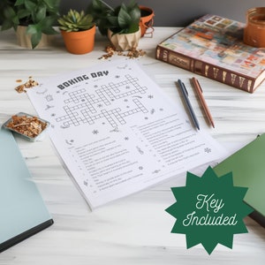 May include: A printable black and white crossword puzzle with the title "Boxing Day" and a list of clues. The puzzle is on a white background with a green star that says "Key Included".