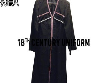 May include: A black 18th Century Uniform coat with red and silver detailing. The coat has a long, flowing design with decorative detailing on the chest. The text "18th Century Uniform" is printed in black.