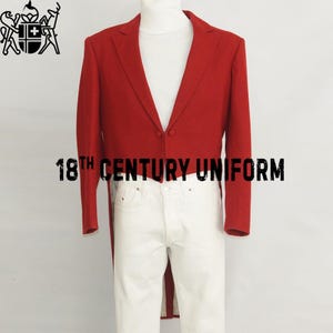 May include: A red 18th Century Uniform jacket with a long tail, paired with white trousers. The jacket has a classic design with two buttons. The text "18th Century Uniform" is displayed in black.