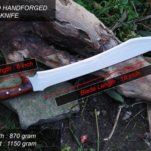 May include: A hand-forged machete knife with a wooden handle. The blade is 18 inches long and the handle is 6 inches long. The knife weighs 1150 grams.