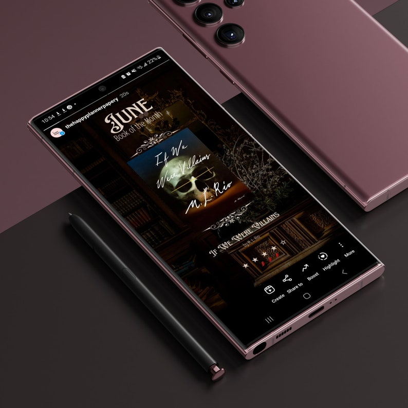 May include: A close-up of a smartphone screen displaying a book cover for "If We Were Villains" by M. L. Rio. The book cover features a skull with a dark background and a gold ornate frame. The screen also shows the book's rating and options to create, share, boost, highlight, and more.