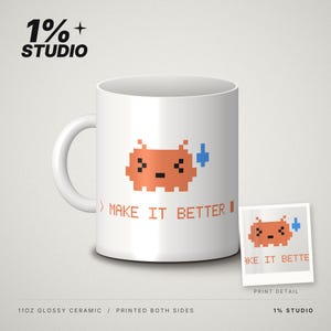 May include: A white ceramic mug with a glossy finish featuring an orange pixelated creature graphic and the text "MAKE IT BETTER". The design is printed on both sides of the 11oz mug. A small inset shows a close-up of the printed graphic detail.