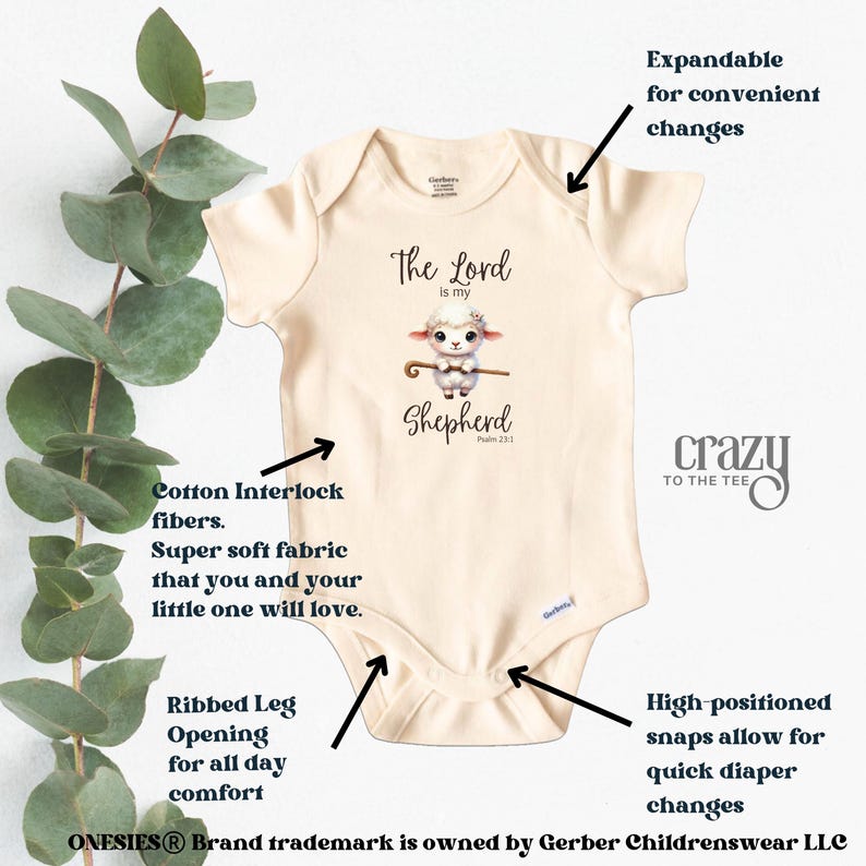 May include: A beige baby onesie with a graphic of a lamb holding a shepherd's staff. The text "The Lord is my Shepherd" is printed on the onesie. The onesie has expandable shoulders for easy changes, ribbed leg openings for comfort, and high-positioned snaps for quick diaper changes.