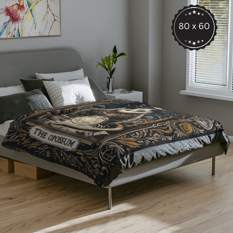 May include: A black and gold duvet cover featuring a vintage illustration of an opossum with the text "THE OPOSSUM". The duvet cover is displayed on a bed with grey bedding and pillows.