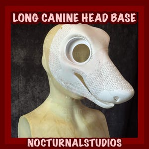 May include: A white canine head base with a long snout, featuring a large eye opening and textured detailing. The text "LONG CANINE HEAD BASE" and "NOCTURNALSTUDIOS" are displayed in a maroon banner.