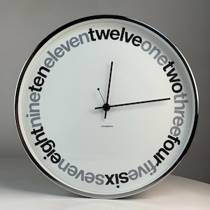 12” Jonsson Text Wall Clock, White & Silver, Metal Glass Modern Designer