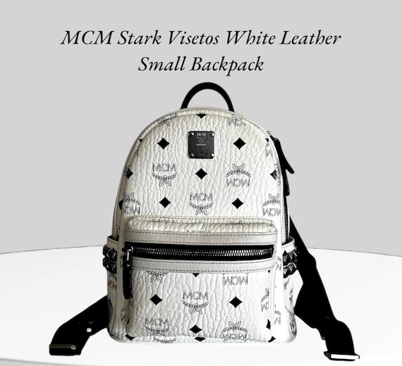 MCM ホワイトバックパック スタッズ付き　袋付き Mini Stark Side Studs Backpack in Visetos White | MCM ®JP