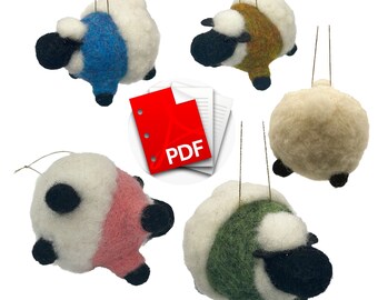 May include: Five felt sheep ornaments in different colours, including blue, green, pink, beige, and brown. Each sheep has a black face and legs. The ornaments are hanging from white strings.