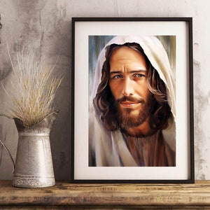 May include: A framed painting of a man with long brown hair and a beard, wearing a white robe. He has a gentle expression and is looking directly at the viewer.