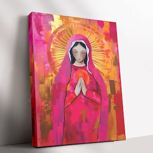 May include: A painting of a woman in a pink robe with a halo of light around her head. She is holding her hands together in prayer. The background is a mix of pink, gold, and orange.