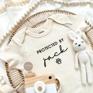 Protected By Dog Name EMBROIDERED Personalized Announcement Baby Onesies®, Custom baby shower gift, custom pet name Custom Dog Onesies®