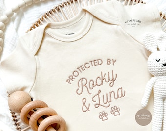 Custom Dog Onesies®, Protected By 2 Dogs Name, Embroidered Personalized Announcement Baby Onesies®, Custom baby shower gift, Newborn Gift