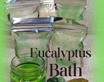 May include: Four small bags of green bath salts with the text "Eucalyptus Bath" and the phrase "cleanse your energy detox your aura" on a green and silver background.