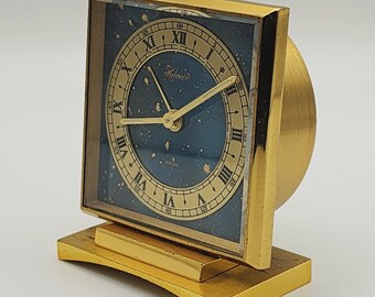 Very rare alarm clock in gold metal with lapis lazuli dial, from the Helveco brand. Alarm clock, clock, pendulum.