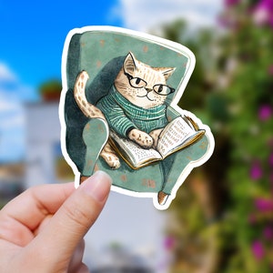 Cute Cat Resting in Green Chair Reading Book, Sticker - Glossy Vinyl - 2, 3, 4, 5, 6 Inch - Kawaii - Decal - Water Resistant