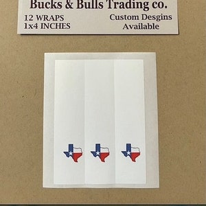 May include: Twelve 1x4 inch Texas flag wraps. The wraps are white with a blue star and red outline of the state of Texas. The image also includes a logo for Bucks & Bulls Trading Co. with the text "Custom Designs Available".