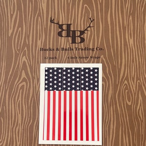 May include: A pack of 12 American flag arrow wraps, each measuring 4 inches long. The wraps feature a red, white, and blue design with stars and stripes. The packaging includes the text "Bucks & Bulls Trading Co." and "12 pack 4 inch Arrow Wraps".