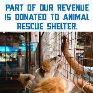 May include: A dog reaches through the bars of a cage towards a person's hand. The text "PART OF OUR REVENUE IS DONATED TO ANIMAL RESCUE SHELTER." is displayed at the top of the image.