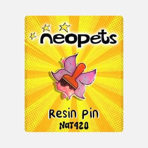 May include: A yellow and orange Neopets themed resin pin featuring a paintbrush with wings. The pin says "Resin Pin" and "Nat420" in black text.