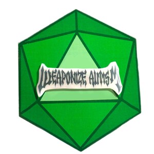 May include: Green gemstone sticker with a white banner that reads "WEAPONIZE AUTISM" in a black gothic font.