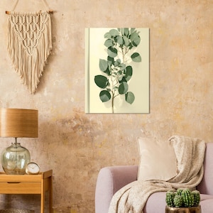 Natural elegance: Stylish poster with proudly climbing eucalyptus branches in front of a beige wall - Matte poster, various sizes