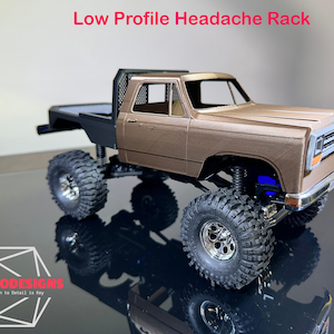 May include: A brown pickup truck with a black headache rack and a black bed. The truck has large tires and a chrome bumper. The truck is on a black surface. The text "BOSS CODESIGNS" is visible in the lower left corner of the image.