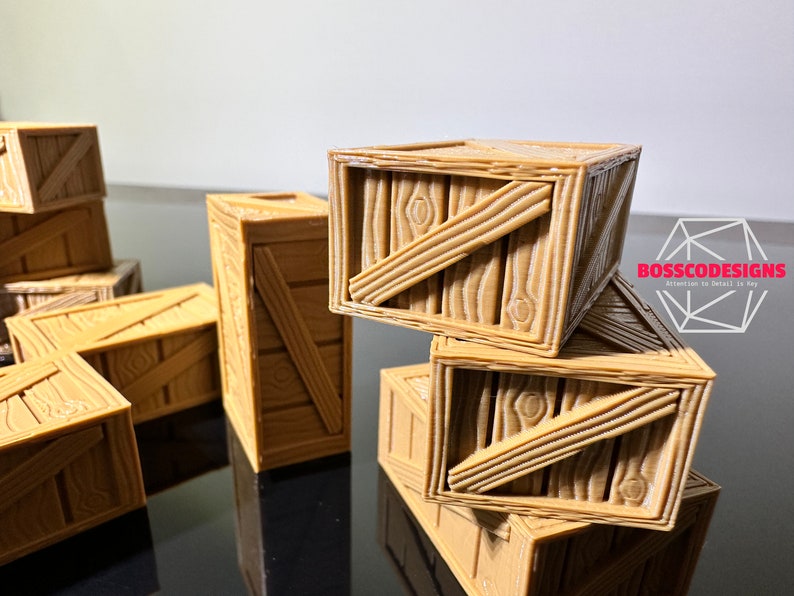 Peut inclure: Un groupe de petites caisses en bois empil&eacute;es les unes sur les autres. Les caisses sont en bois brun clair et ont un design simple. Les caisses sont parfaites pour ajouter une touche rustique &agrave; n'importe quelle pi&egrave;ce.