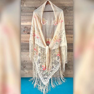 Chal de punto con triángulos y flecos con estampado floral vintage de los años 70