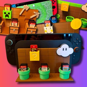 Może przedstawiać: Czarna konsola Nintendo Switch jest prezentowana z kartridżami do gier w tematycznej ekspozycji. Ekspozycja zawiera brązowe cegły, zielone rury, białą chmurę i żółty blok ze znakiem zapytania. Kartridże są oznaczone tytułami gier.