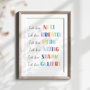 May include: A framed print with the text "Ich bin NETT", "Ich bin KREATIV", "Ich bin KLUG", "Ich bin MUTIG", "Ich bin STARK", and "Ich bin GELIEBT" in colourful letters.