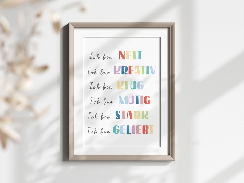 May include: A framed print with the text "Ich bin NETT", "Ich bin KREATIV", "Ich bin KLUG", "Ich bin MUTIG", "Ich bin STARK", and "Ich bin GELIEBT" in colourful letters.