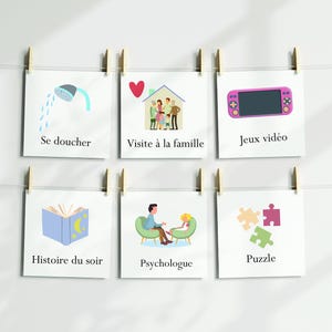 Puede incluir: Seis tarjetas cuadradas con ilustraciones y texto est&aacute;n sujetas a una cuerda. Las tarjetas representan una ducha, una familia, una consola de videojuegos, un libro, un terapeuta y un rompecabezas. El texto est&aacute; en franc&eacute;s.