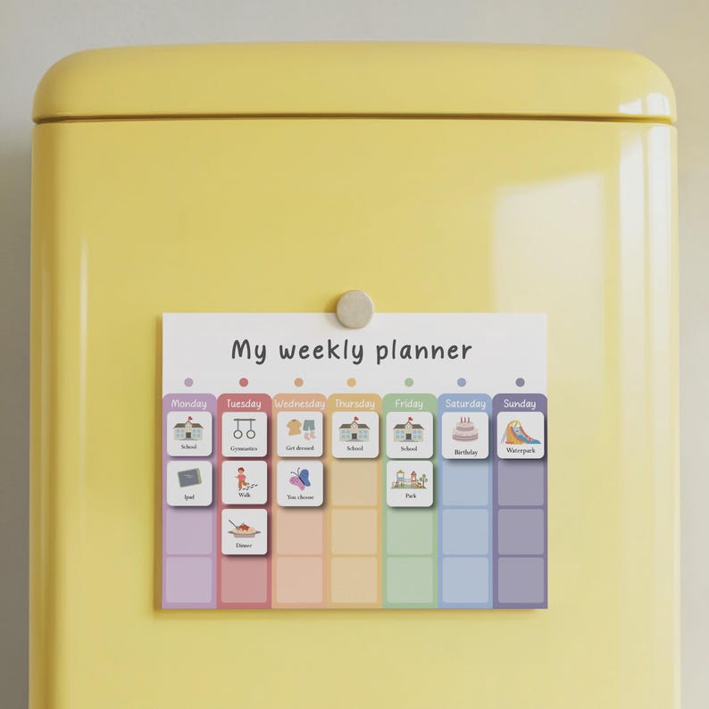 May include: A colorful weekly planner with the text "My weekly planner" and illustrated activity icons. The planner is attached to a yellow surface with a magnet. The days of the week are color-coded.