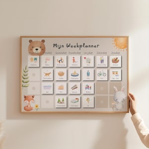 May include: A wooden-framed weekly planner with a light background and illustrated squares. The planner features a bear, fox, and bunny, with the text "Mijn Weekplanner" at the top. Each square has a different activity.
