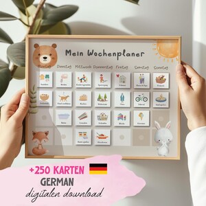 May include: A brown wooden framed weekly planner with a bear illustration and the text "Mein Wochenplaner". The planner has a grid with days of the week labeled in German: Montag, Dienstag, Mittwoch, Donnerstag, Freitag, Samstag, Sonntag.  The planner includes colorful illustrations of activities and objects, such as a bike, a book, a bath, and a car. The text "+250 KARTEN GERMAN digitalen download" is at the bottom of the image.