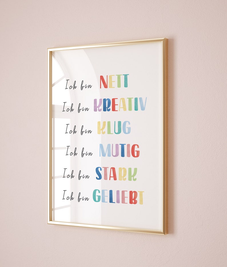 May include: A framed print with the text "Ich bin NETT", "Ich bin KREATIV", "Ich bin KLUG", "Ich bin MUTIG", "Ich bin STARH", and "Ich bin GELIEBT" in colourful letters.